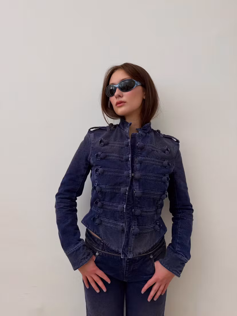 Lola Tung wears a military jacket.