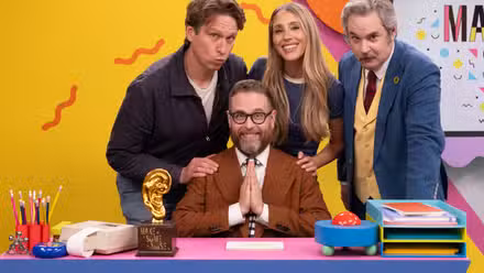 Make Some Noise Season 5 photo showing Sam Reich, Pete Holmes, Lisa Gilory, and Paul F. Thompkins behind the desk