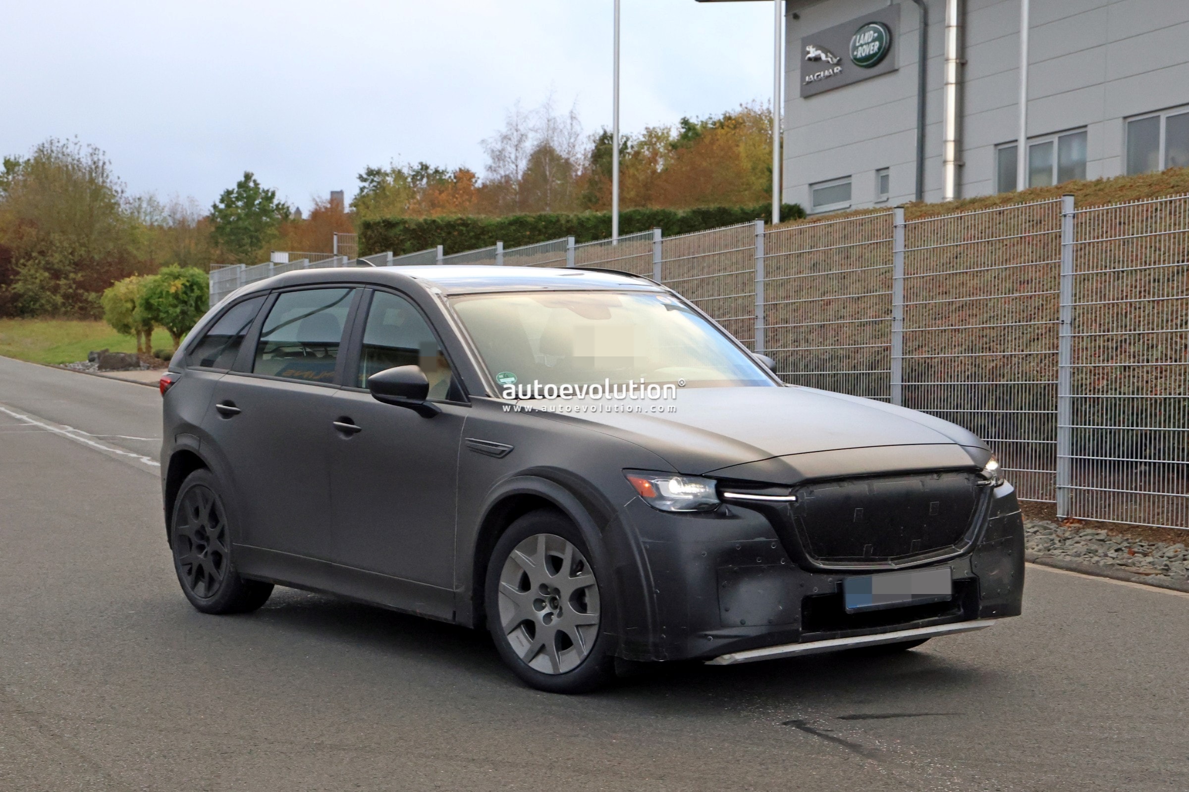 Mazda CX- 90 Electric SUV Mule Spied Going Into Jaguar Land Rover’s Nurburgring Examination Facility