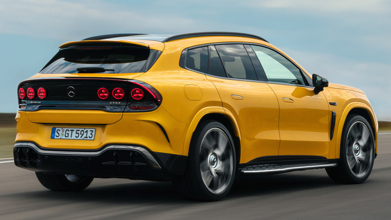 A bright yellow Mercedes-AMG GT SUV driving