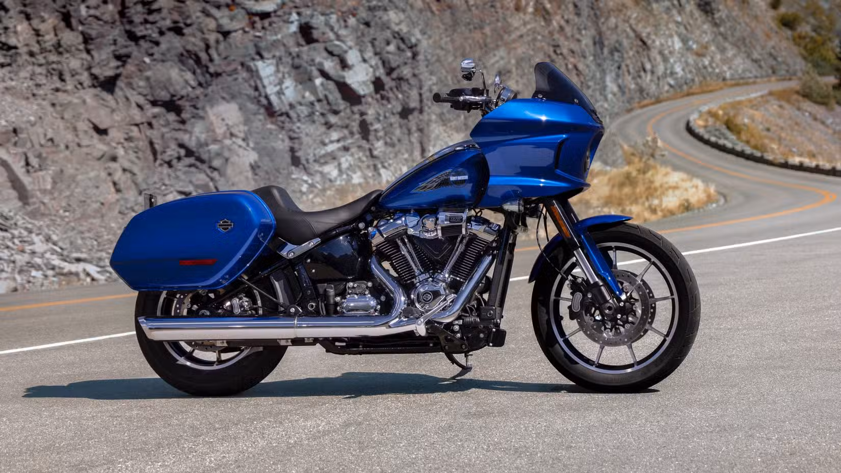 2025 Harley-Davidson Low Rider ST parked on a mountain road, side profile view