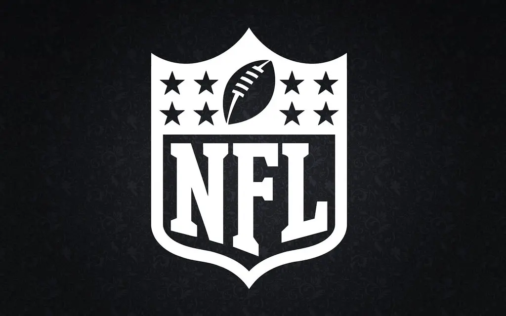 The National Football League shield logo in white on a dark background.