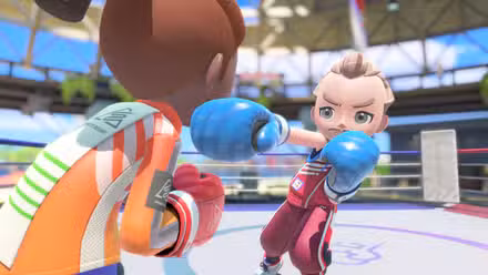 A boxer jabs and just misses his opponent