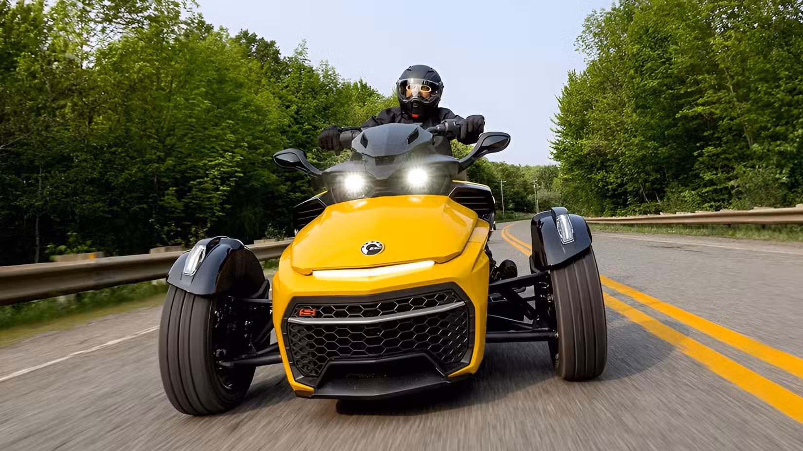 Can-Am Spyder F3-S in yellow on the road front fascia cinematic shot