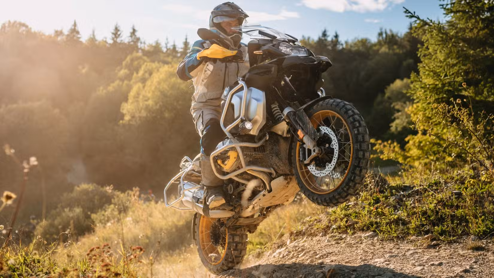 BMW R 1250 GS Adventure popping a wheelie on a trail run