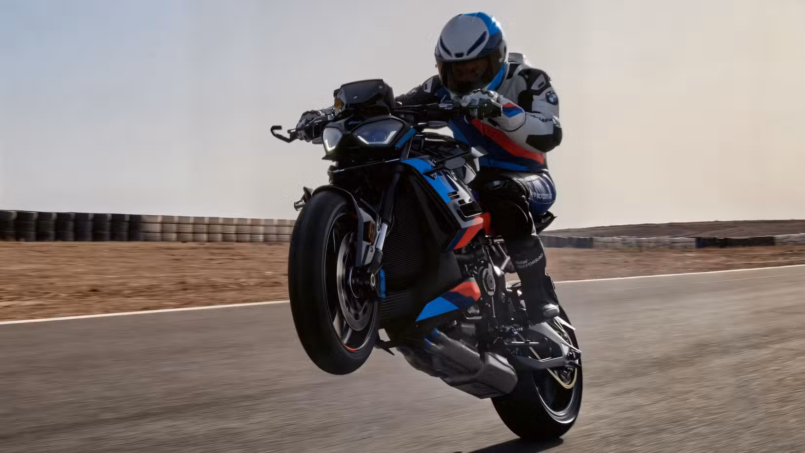 Rider popping a wheelier on the BMW M 1000 R 