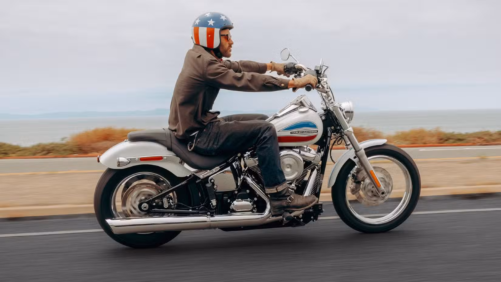 Panning Shot Of 2026 Harley-Davidson Super Glide Riding On The Road Right Side