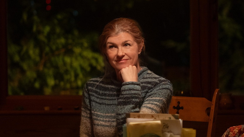 Ellen sitting outside and smiling in Phony