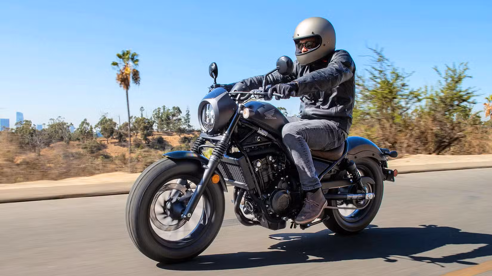 Action shot of a 2020 Honda Rebel 500 riding through the desert