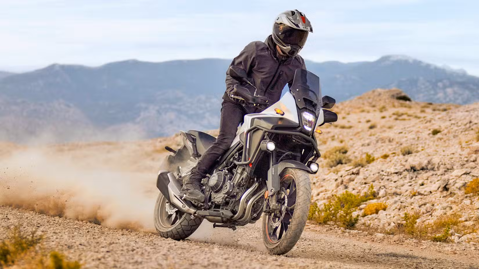 Rider on a Honda NX500 off-roading front third quarter view