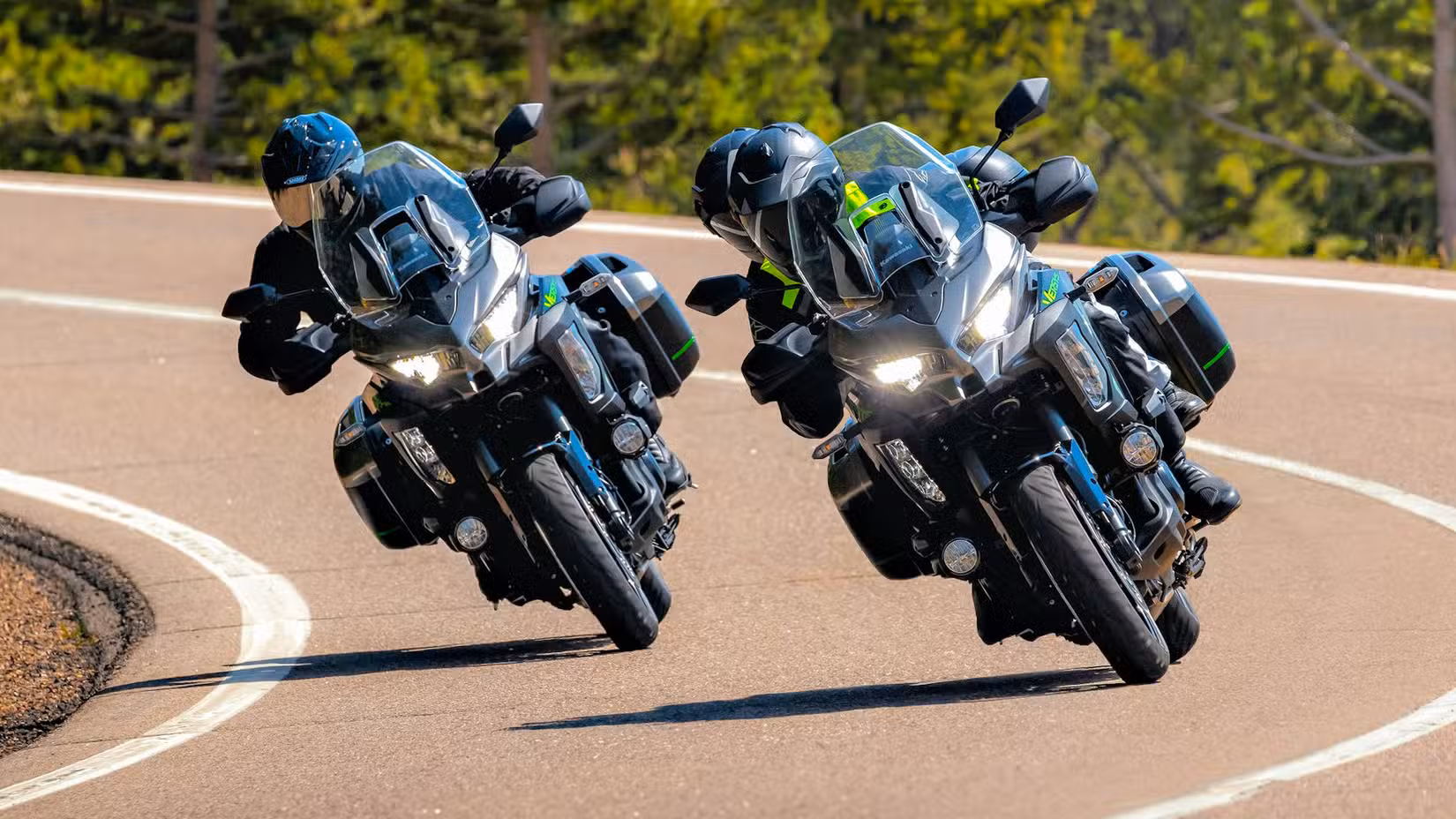 Two riders taking a right turn on 2025 Kawasaki Versys 1100 SE LT
