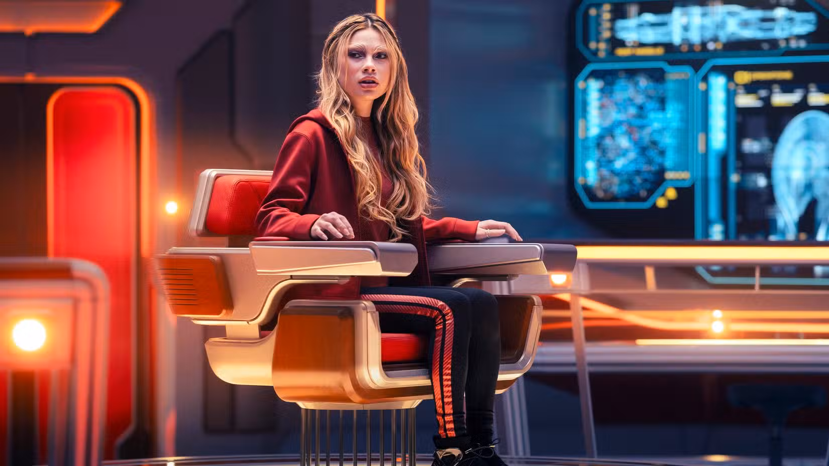 Genesis Lythe (Bella Shepard) sits in the captain's chair on the USS Athena in Starfleet Academy