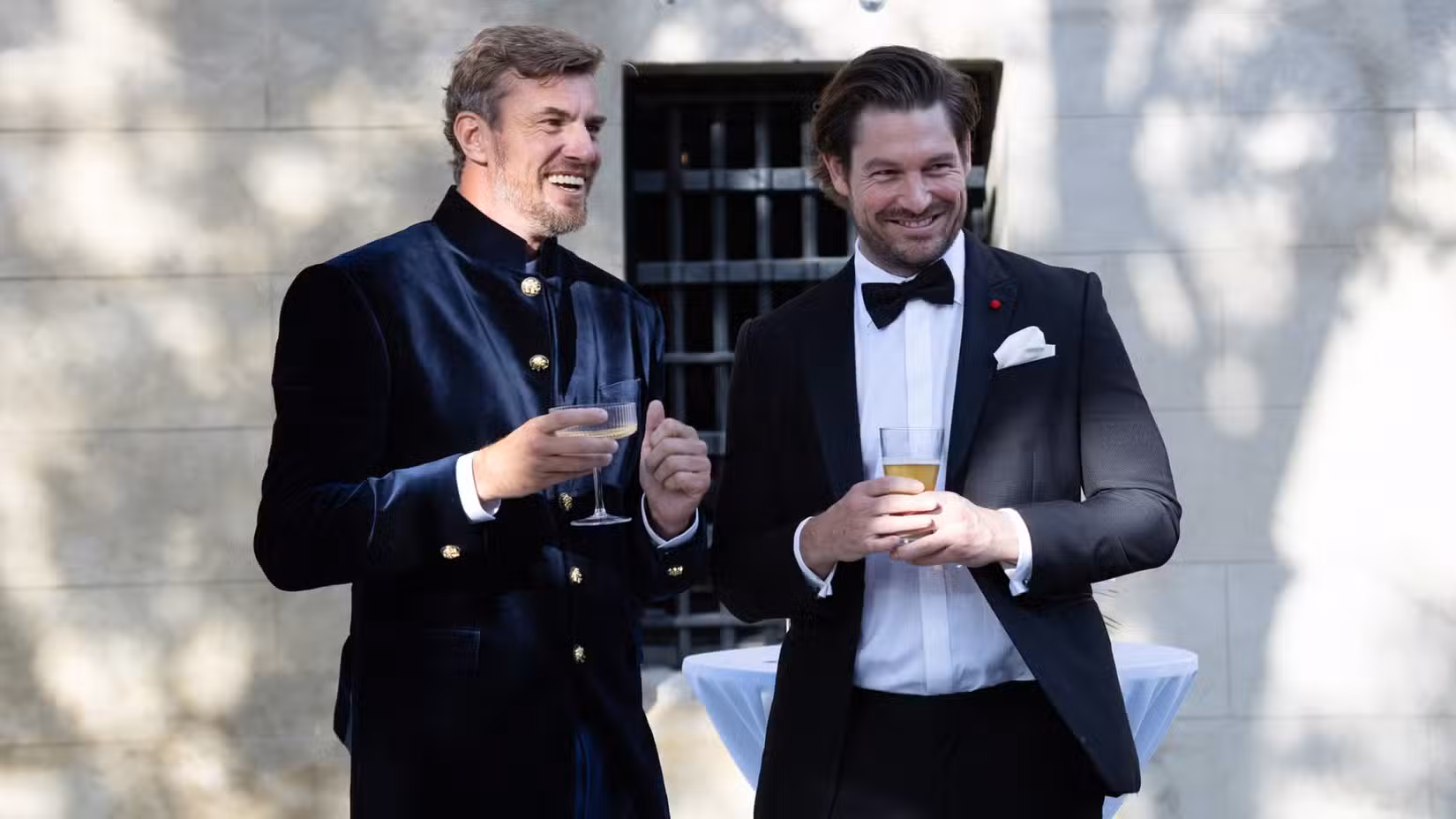 Shep Rose and Craig Conover dressed formally, holding drinks in Southern Charm