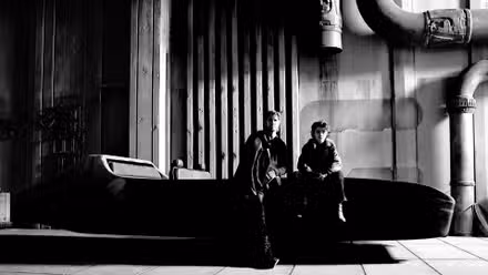 Ryan Gosling and Flynn Gray sit on a landspeeder in a set photo from Star Wars: Starfighter