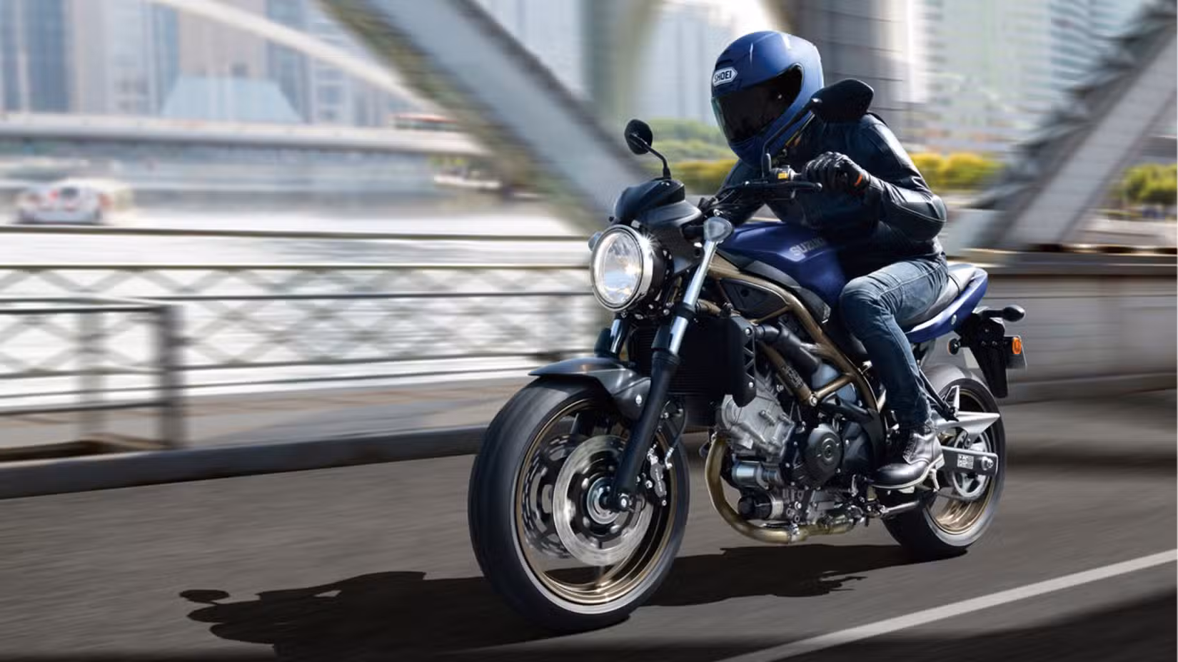 Motion shot of a Suzuki SV650 ABS ridden on a bridge