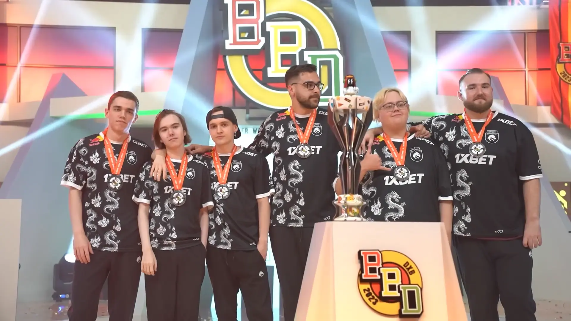 The Team Spirit esports team posing with a trophy at the BetBoom Dacha Dubai 2023 tournament.