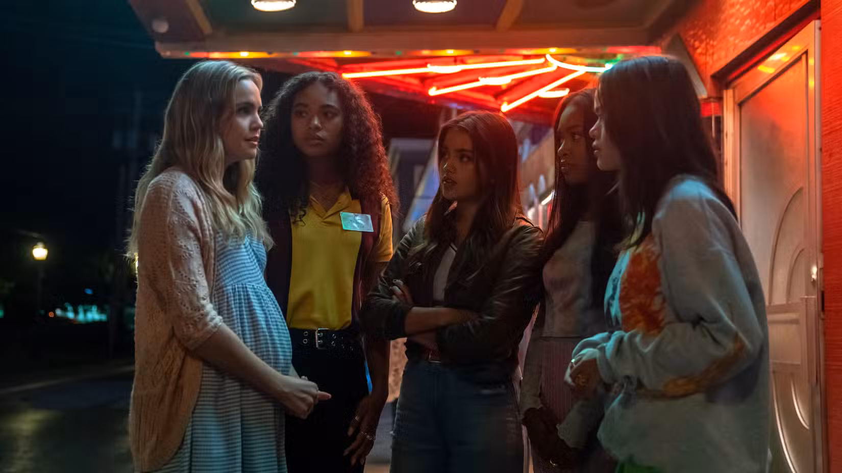 The liars look worried while standing outside the theater in Pretty Little Liars: Original Sin