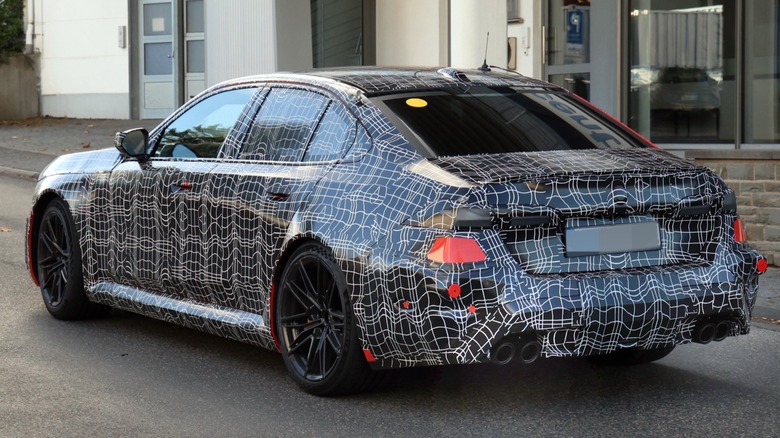 BMW M5 sedan prototype spy shot, rear angle