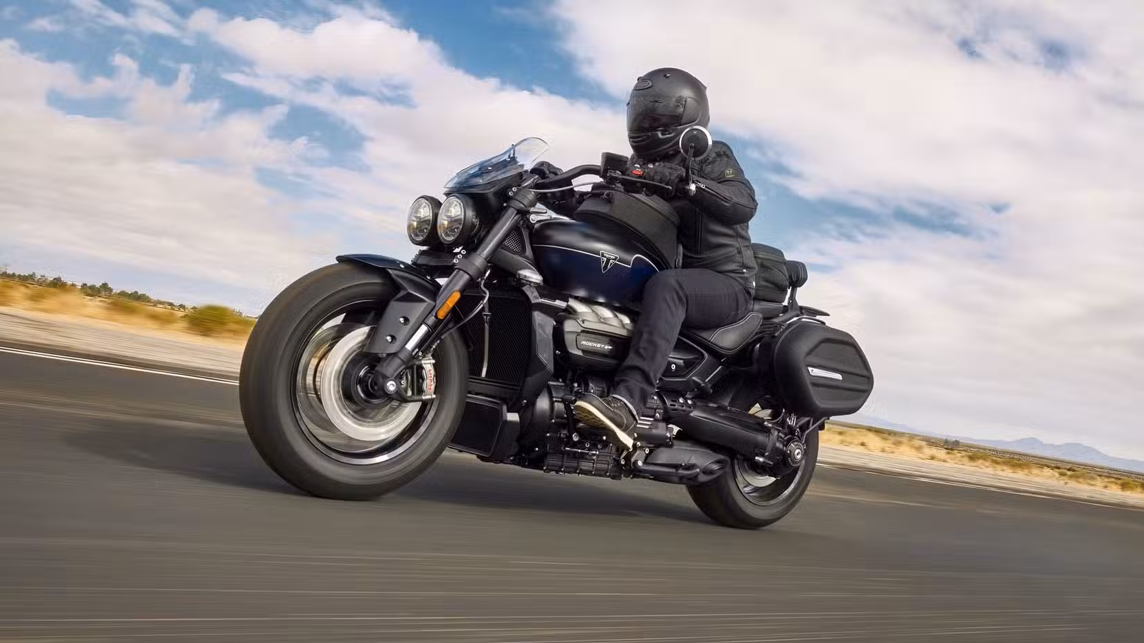 Motion shot of Triumph Rocket 3 Storm GT accelerating on the road