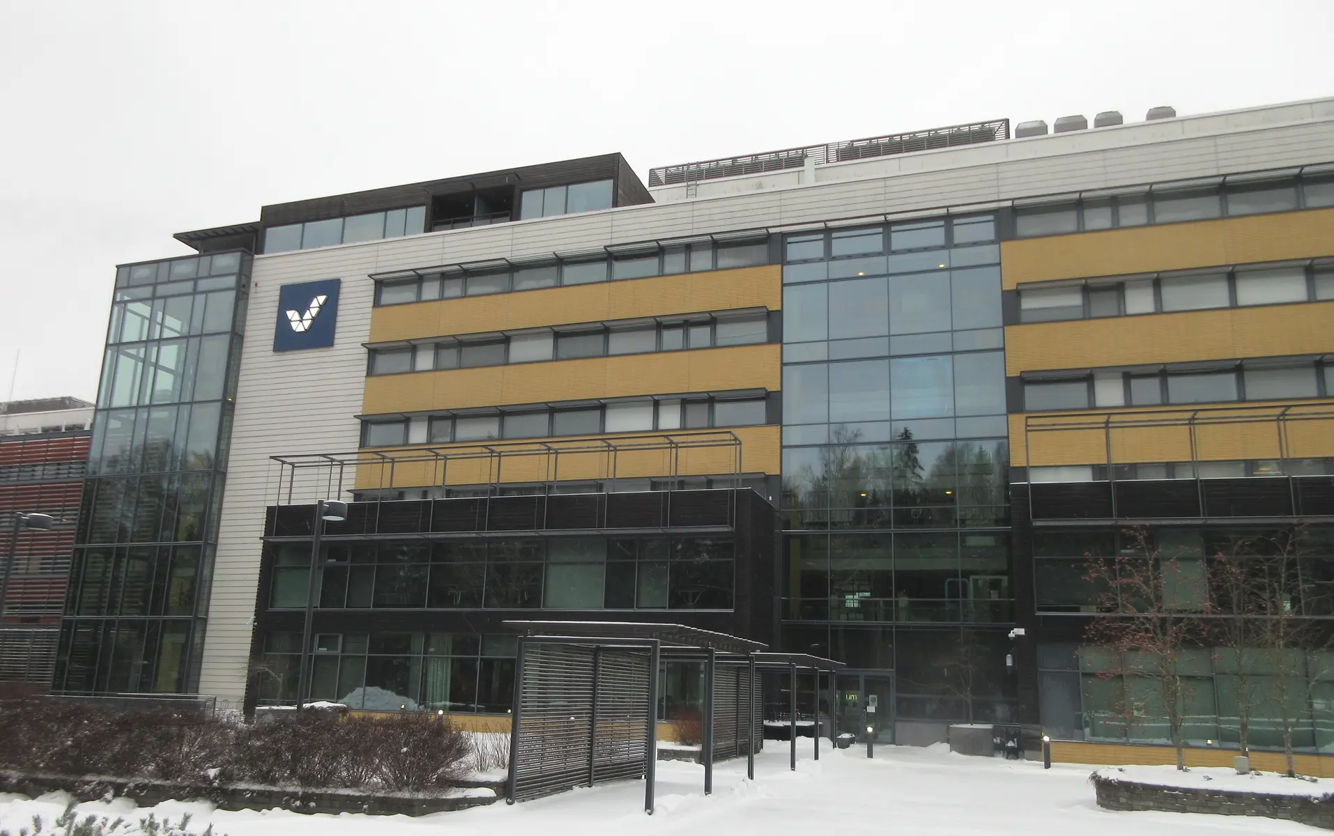 The headquarters building of Veikkaus in Finland, featuring the company logo on the facade.
