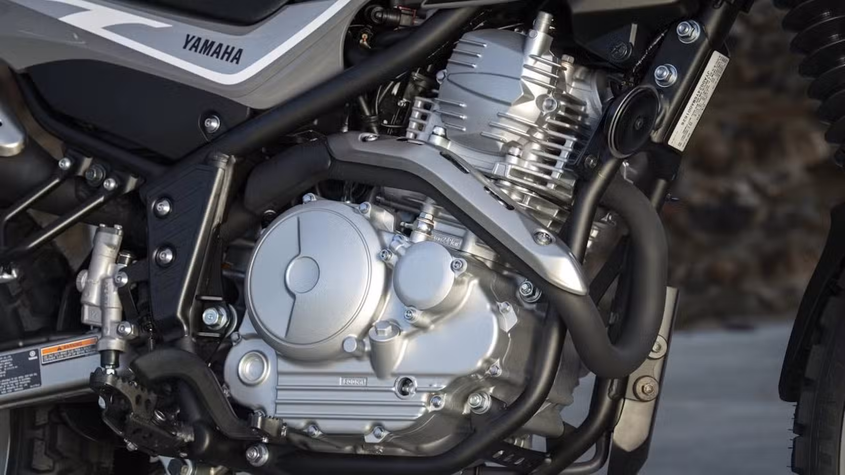 A close-up shot of the XT250's engine