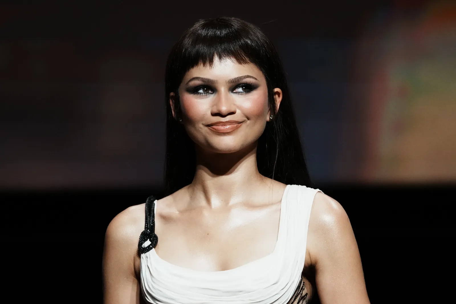 Zendaya wears short choppy baby bangs.