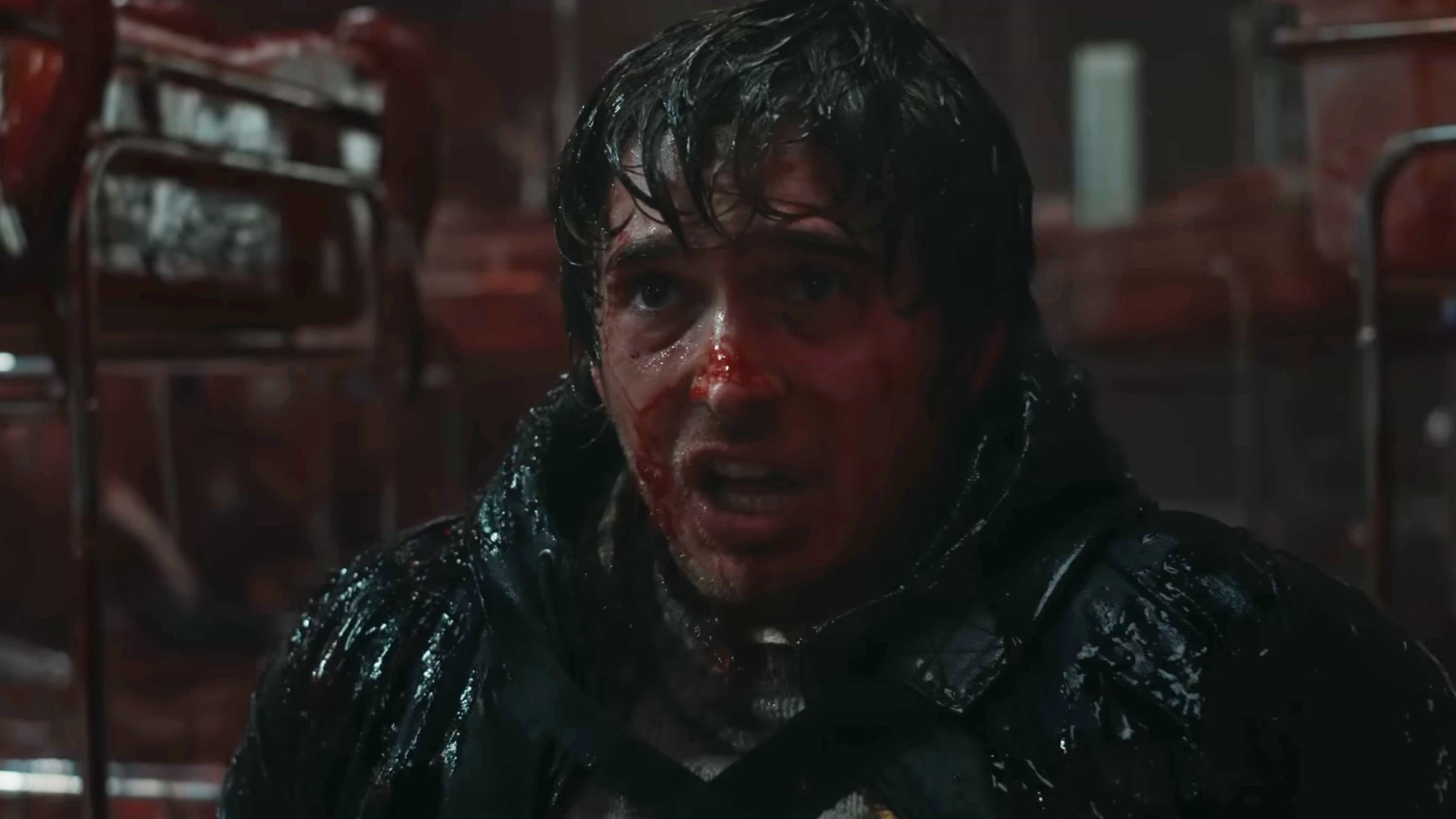 Austin Abrams covered in blood in Resident Evil.